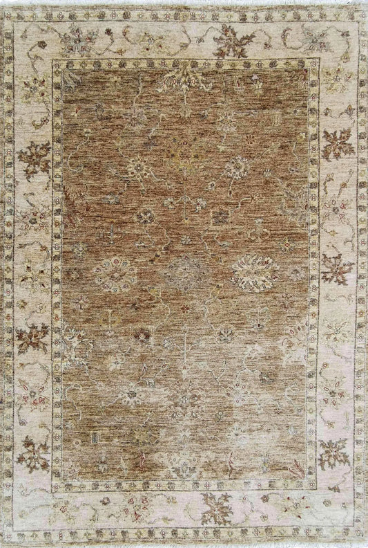 A traditional Ziegler wool rug with beige background and brown floral patterns, rectangular in shape.