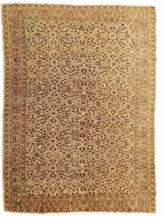 A beige and brown colored wool rug with a traditional geometric pattern.