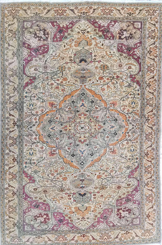 A large rectangular Anatolian rug with a red background and pink secondary accents, featuring intricate geometric and floral motifs.