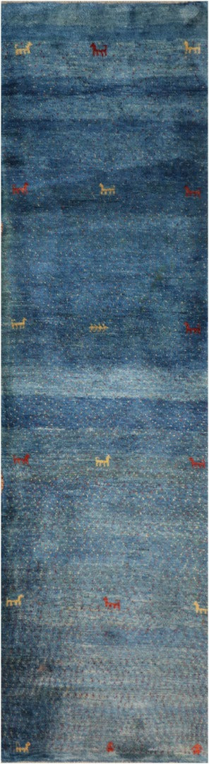 Gabbeh Tribal Wool Rug with a blue background