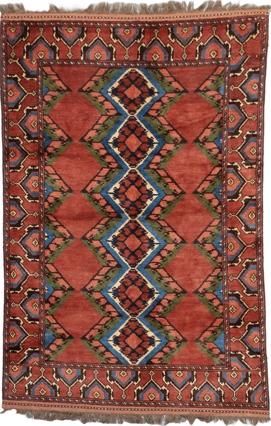 A geometric patterned Afghan Tribal Wool Rug in beige, red, and other colors.