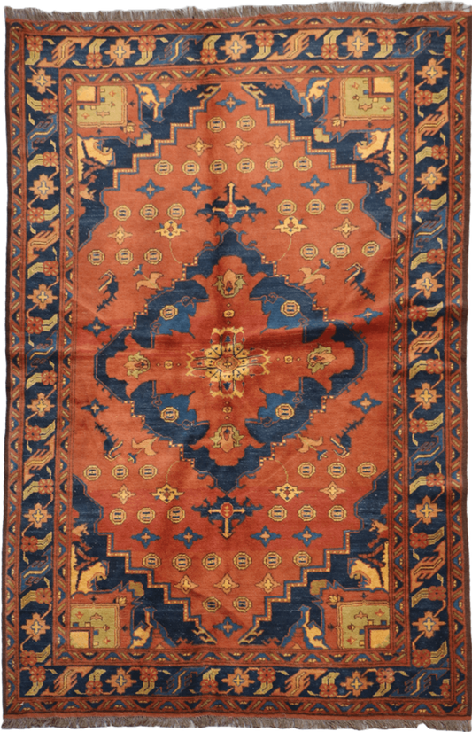 A vibrant orange and blue geometric-patterned wool rug
