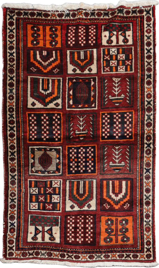 A hand-knotted Persian Qashqai Tribal Wool Rug