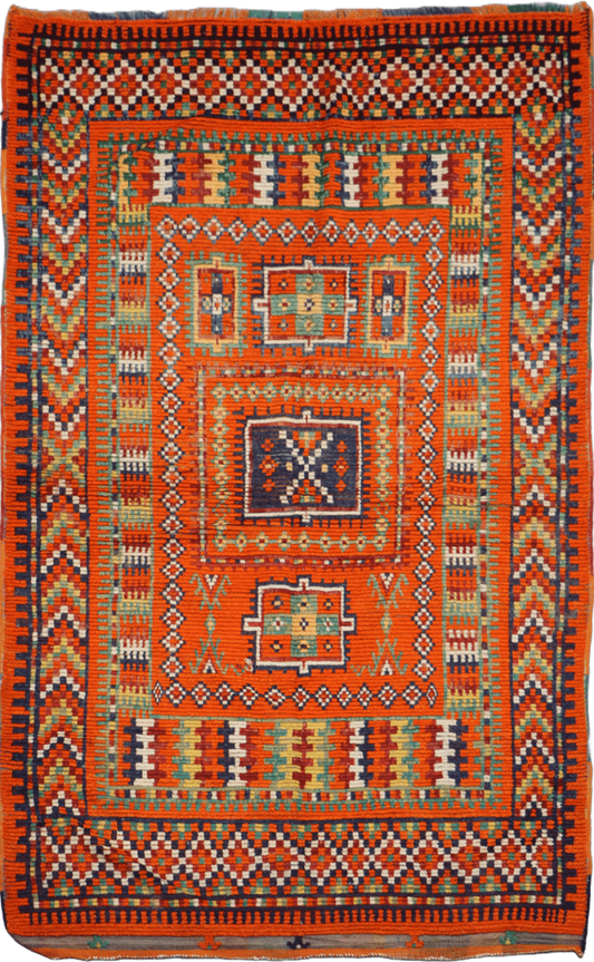 A vibrant orange and multicolored Berber tribal wool rug