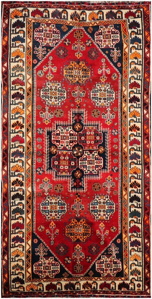A vibrant red Persian Qashqai tribal rug