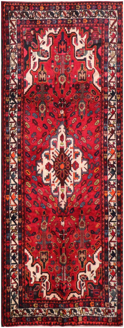 A bold red Hamedan tribal rug