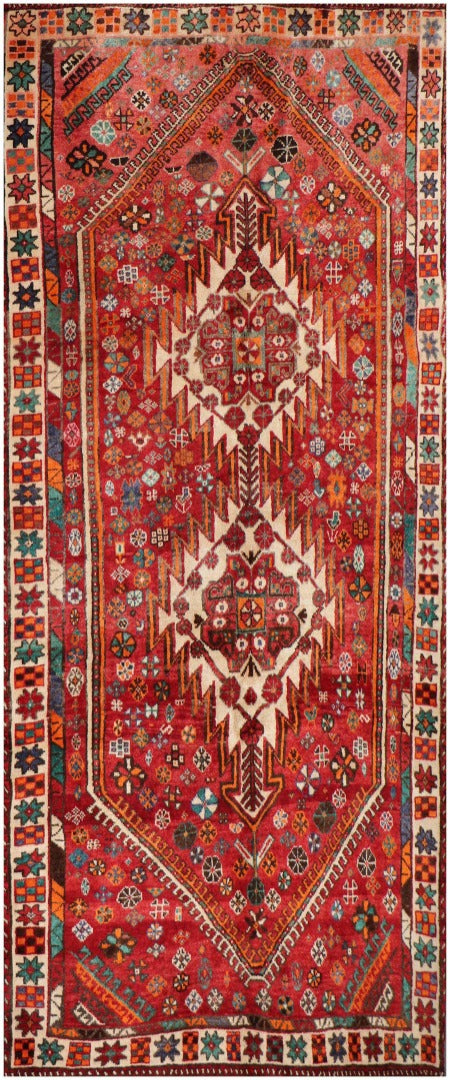 A hand-knotted Persian Qushqai Tribal Rug