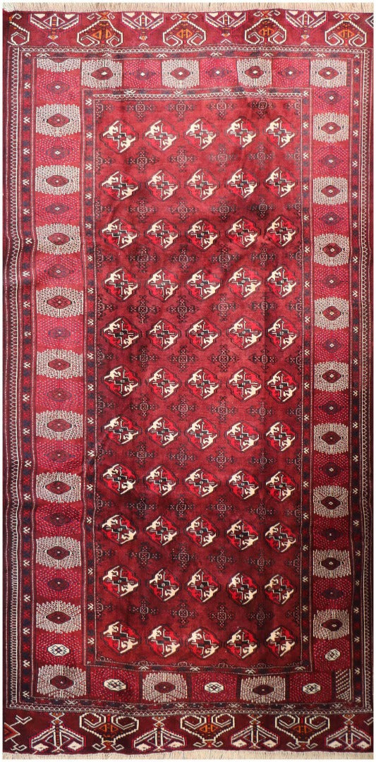 A hand-knotted Turkeman Tribal Wool Rug