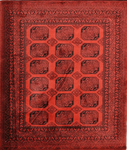 A rectangular, machine-made Afghan rug with a red and black geometric pattern.