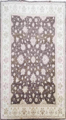 A Ziegler Wool Rug with a geometric pattern primarily in brown color with cream accents, measuring 252 x 300 cm.