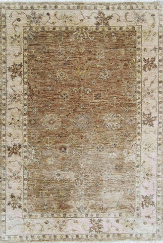 A traditional Ziegler wool rug with beige background and brown floral patterns, rectangular in shape.