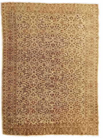 A beige and brown colored wool rug with a traditional geometric pattern.