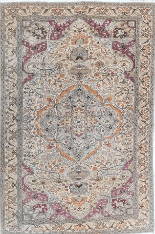 A large rectangular Anatolian rug with a red background and pink secondary accents, featuring intricate geometric and floral motifs.
