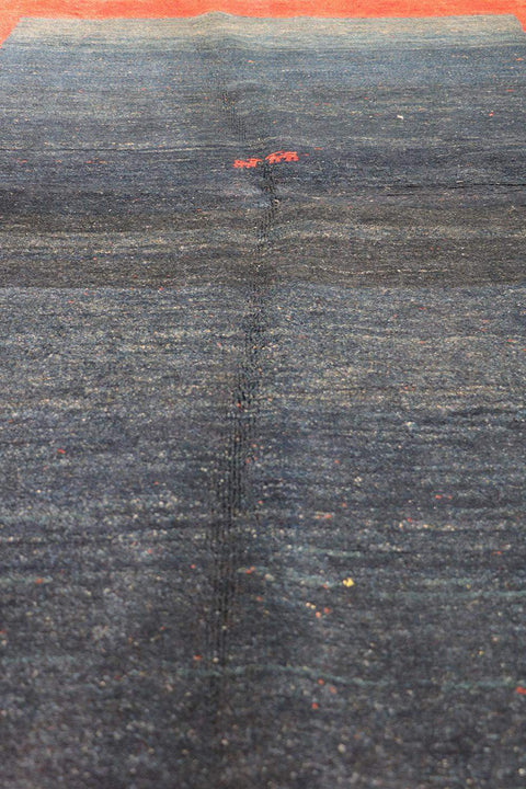 A traditional Gabeh Tribal Wool Rug