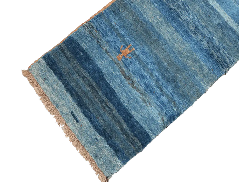 A vertical image of a Gabbeh Runner Tribal Wool Rug