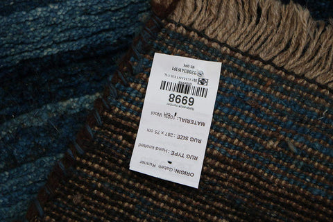 A vertical image of a Gabbeh Runner Tribal Wool Rug