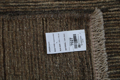 A rectangular Gabbeh Tribal Wool Rug with a mix of grey and cream hues, featuring a traditional hand-knotted design.