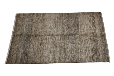 A rectangular Gabbeh Tribal Wool Rug with a mix of grey and cream hues, featuring a traditional hand-knotted design.