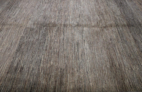 A rectangular Gabbeh Tribal Wool Rug with a mix of grey and cream hues, featuring a traditional hand-knotted design.