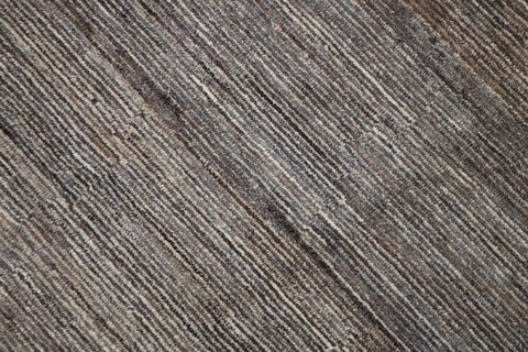 A rectangular Gabbeh Tribal Wool Rug with a mix of grey and cream hues, featuring a traditional hand-knotted design.
