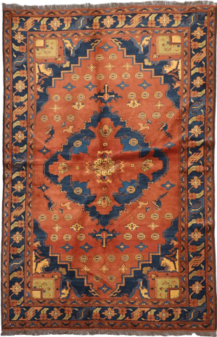 A vibrant orange and blue geometric-patterned wool rug