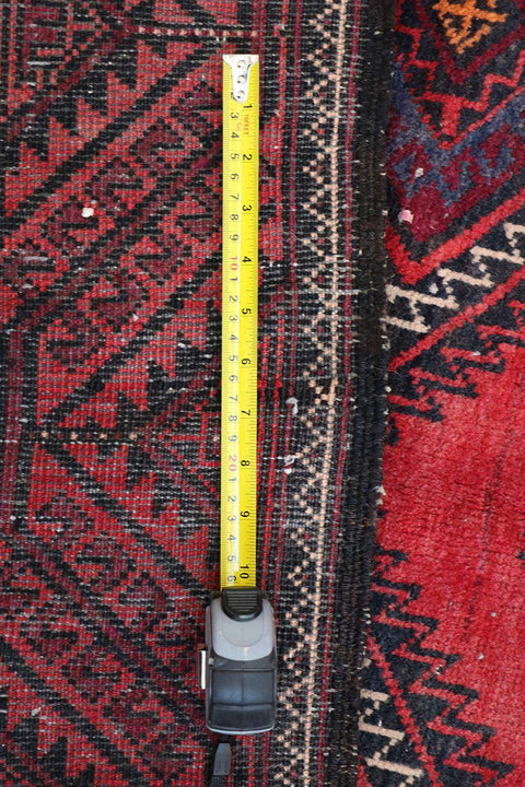 A hand-knotted Afghan Tribal Wool Rug