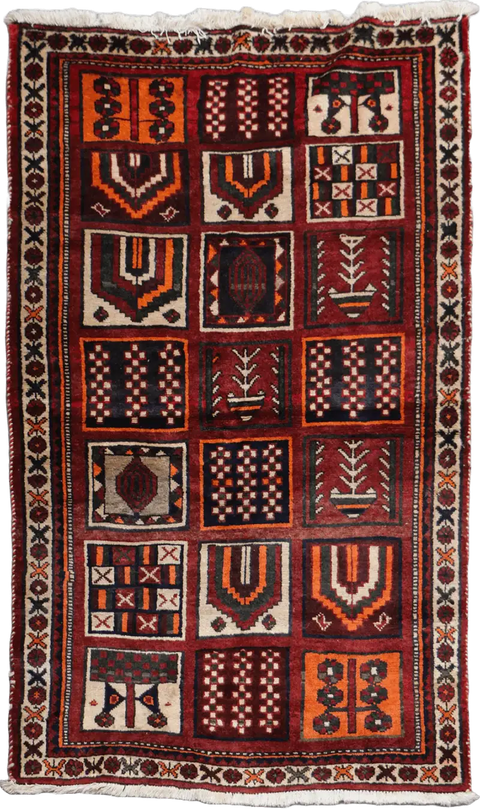 A hand-knotted Persian Qashqai Tribal Wool Rug