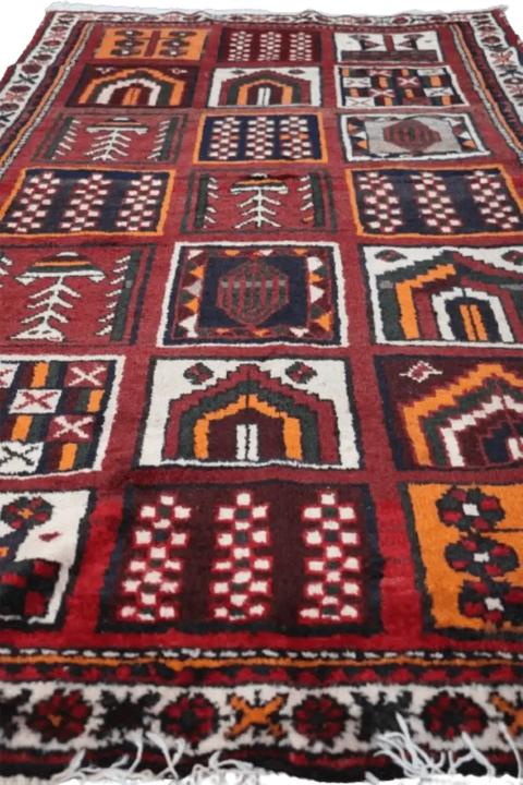 A hand-knotted Persian Qashqai Tribal Wool Rug