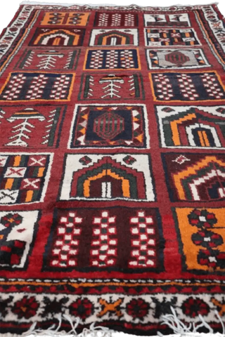 A hand-knotted Persian Qashqai Tribal Wool Rug