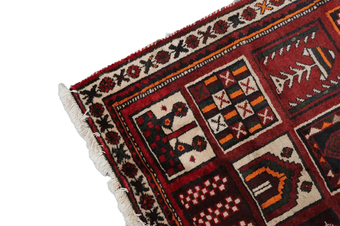 A hand-knotted Persian Qashqai Tribal Wool Rug