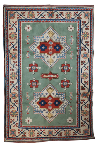 A rectangular Turkish Milas Tribal Wool Rug