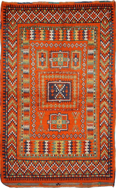 A vibrant orange and multicolored Berber tribal wool rug