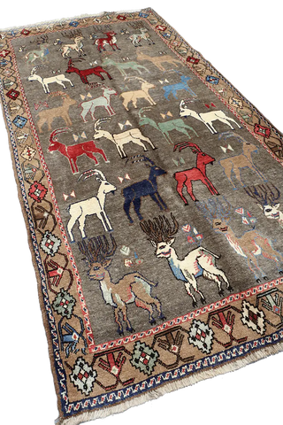 A Persian Qashqai wool rug