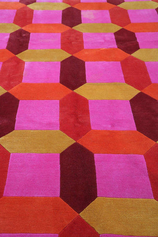 A geometric patterned wool rug 