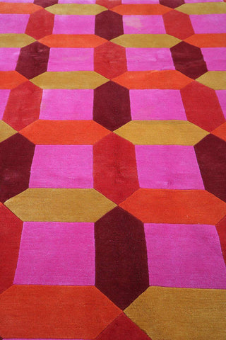 A geometric patterned wool rug 