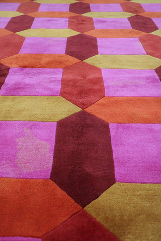 A geometric patterned wool rug 