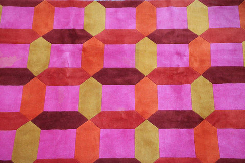 A geometric patterned wool rug 