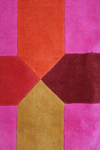 A geometric patterned wool rug 