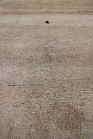 A beige and cream Persian Gabbeh Tribal Rug