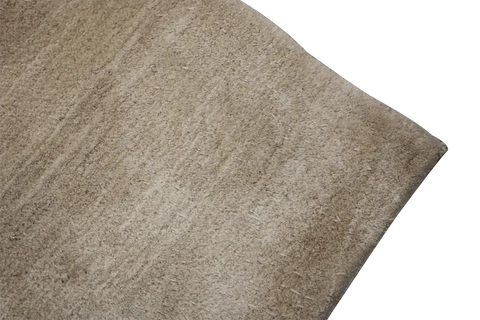 A beige and cream Persian Gabbeh Tribal Rug