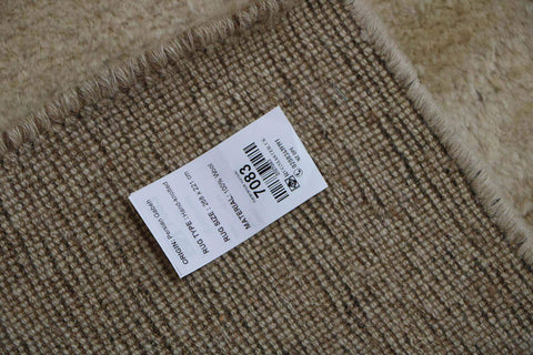 A beige and cream Persian Gabbeh Tribal Rug