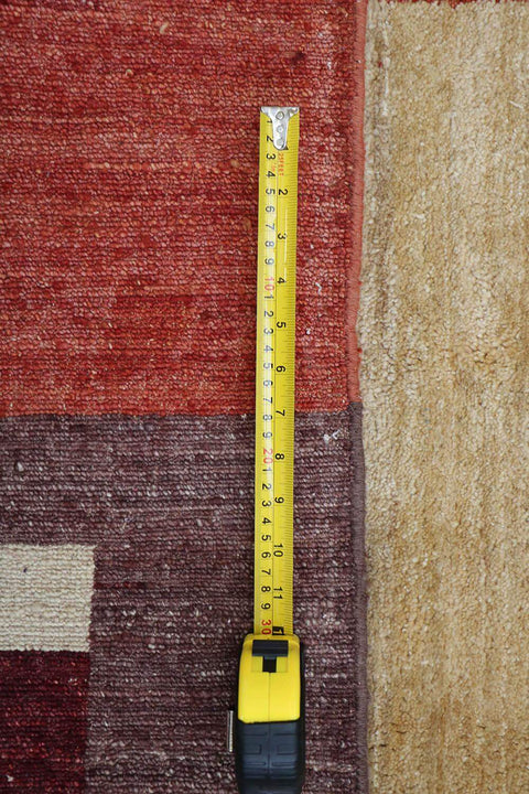 A rectangular Gabbeh tribal wool rug