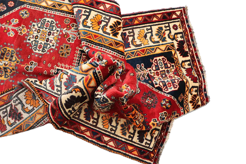 A vibrant red Persian Qashqai tribal rug