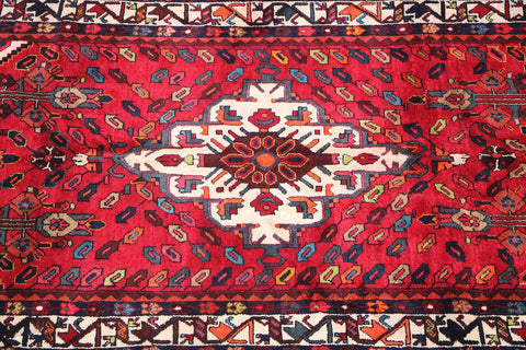A bold red Hamedan tribal rug