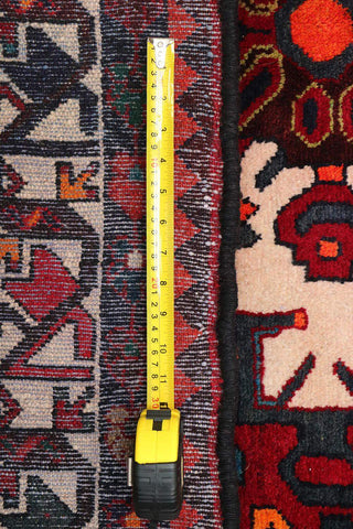 A bold red Hamedan tribal rug