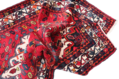 A bold red Hamedan tribal rug