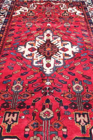 A bold red Hamedan tribal rug