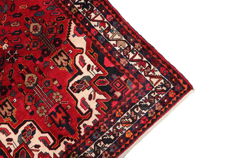 A bold red Hamedan tribal rug