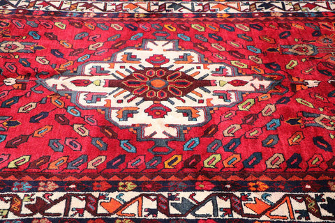 A bold red Hamedan tribal rug