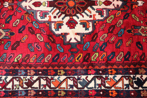 A bold red Hamedan tribal rug
